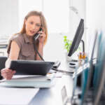 Portrait of young woman working in office, Jersey City, New Jersey, USA