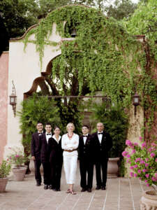 Estate manager standing with house staff