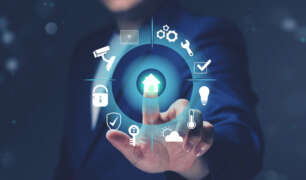 A man in a suit interacting with a digital smart home interface, symbolizing how modern butlers manage technology in luxury households.