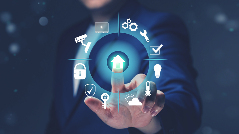 A man in a suit interacting with a digital smart home interface, symbolizing how modern butlers manage technology in luxury households.