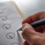 Deep cleaning checklist for housekeeper being marked off, showing organized seasonal home cleaning tasks.